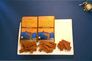 Image of packages of smoked and peppered jerky bags and the product itself on a plate.